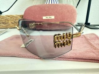 Occhiali da sole Miu Miu dorati e grigi