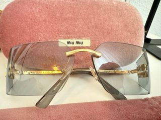 Occhiali da sole Miu Miu dorati e grigi