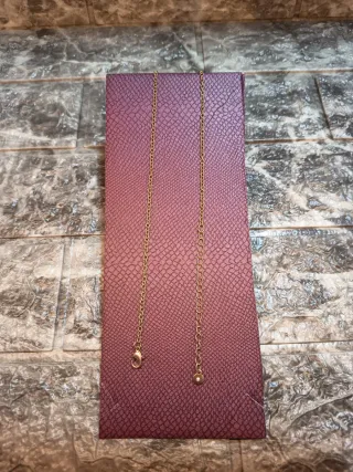 Collana con ciondolo a forma di piuma