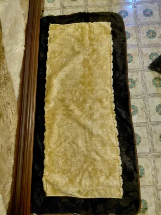 Coperta matrimoniale e tappeti