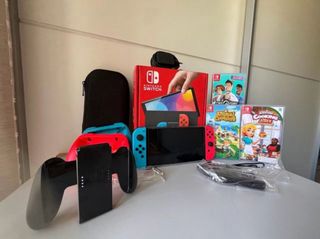 Nintendo Switch OLED + Animal Crossing + 2 Giochi