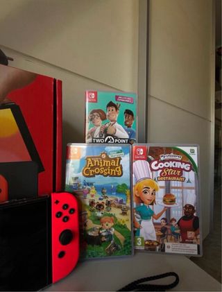 Nintendo Switch OLED + Animal Crossing + 2 Giochi