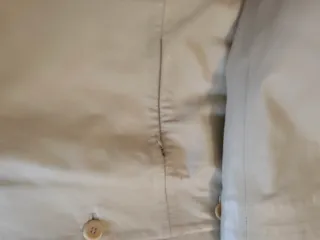 Abrigo de cuero beige con cuello de pelo