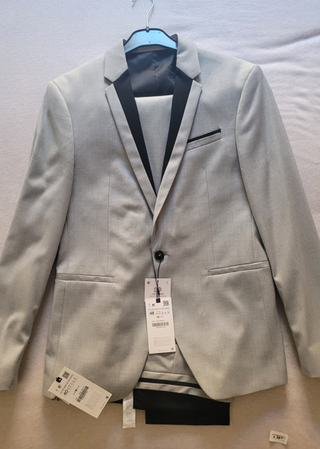 Traje chaqueta gris y negro a estrenar