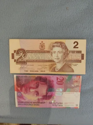 20 francos suizos y 2 dólares canadienses
