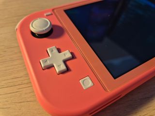 Switch Lite Rosa + Carcasa + Funda + Cristal