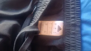 Pantalón chándal Adidas negro y turquesa