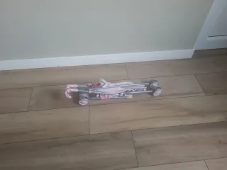 Sillita de paseo plegable con muñeca.