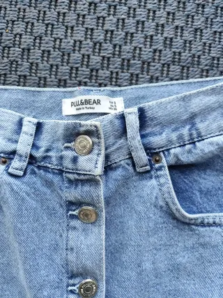 Dos faldas, una  vaquera y otra  gris Pull&Bear