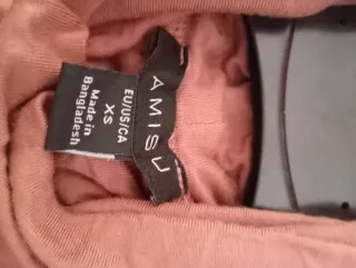 Blusa rosa de manga larga con cuello alto