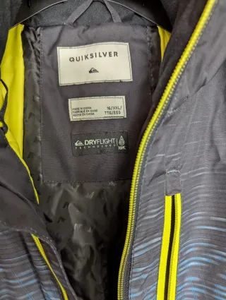 Chaqueta Quiksilver azul y amarilla, talla 16.