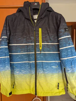 Chaqueta Quiksilver azul y amarilla, talla 16.