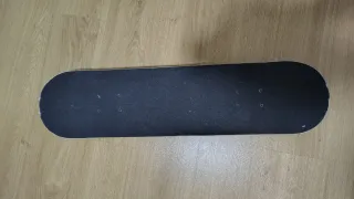 Monopatín con diseño galaxia