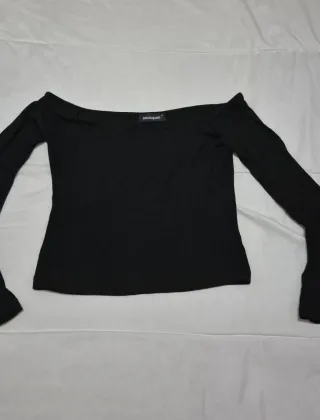 Blusa negra punto mangas acampanadas