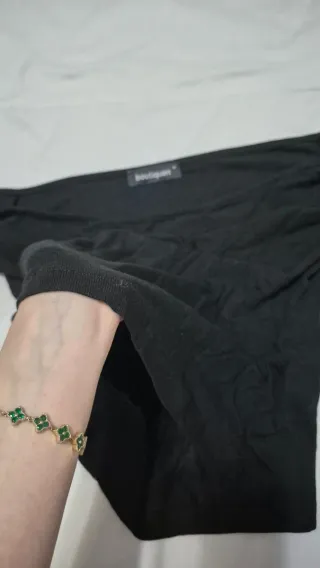 Blusa negra punto mangas acampanadas