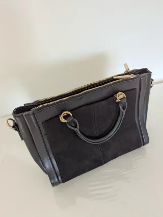 Bolso negro mano o bandolera