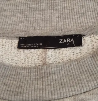 Sudadera gris manga abullonada