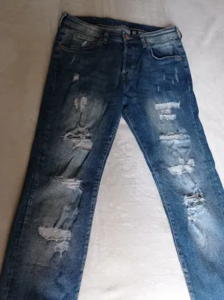 Pantalón vaquero H&M rotos zurcido azul