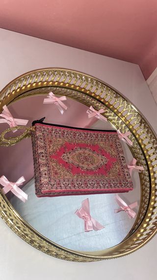 Monedero oriental rosa y dorado