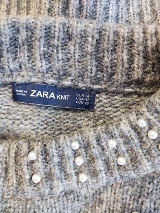 Jersey gris perlas escote y mangas