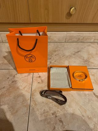 Pulsera Hermès Dorada y Blanca