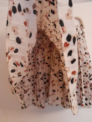 Mini falda plisada estampada con lunares