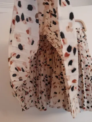 Mini falda plisada estampada con lunares