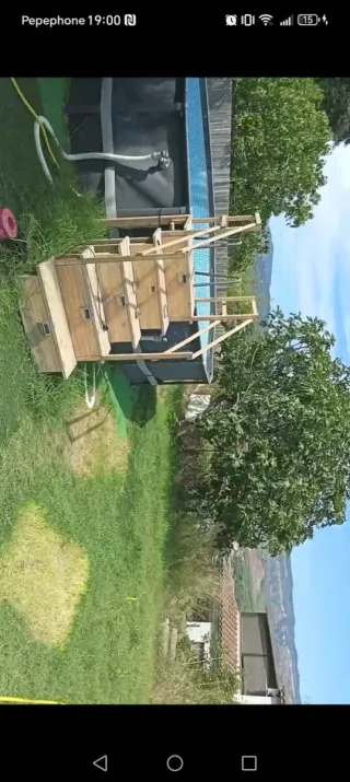 Piscina 22000L con escalera de madera