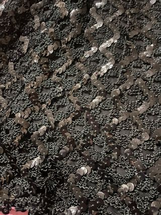 Top nero con paillettes