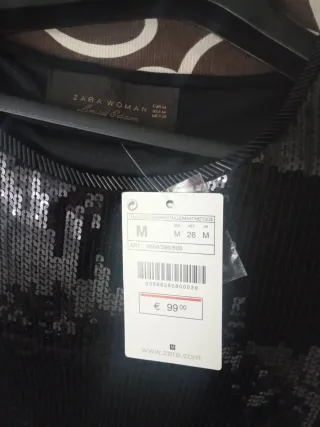 Vestido fiesta negro con plumas