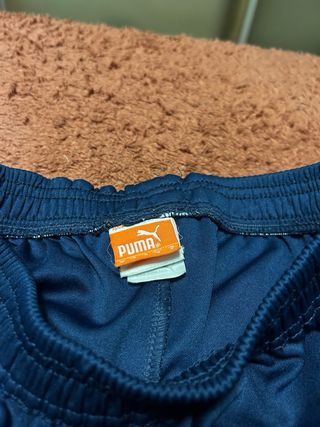 Pantalones deportivos azules con cremallera