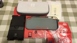 Nintendo Switch Lite + Mario Odyssey + Accessori
