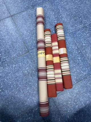Rollos de tela gruesa con rayas
