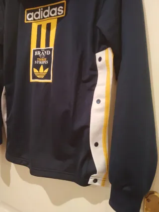 Chaqueta Adidas azul y amarilla