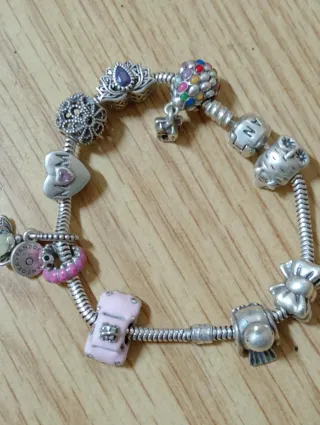 Pulsera Pandora Plata con Charms,casi compla.plata