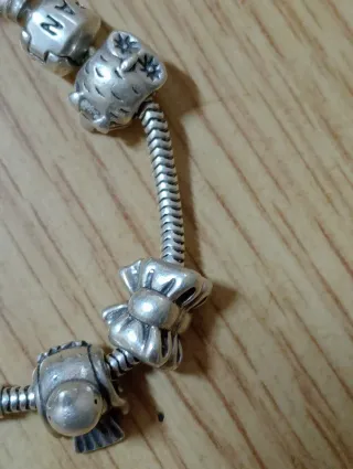 Pulsera Pandora Plata con Charms,casi compla.plata