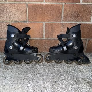 Pattini a rotelle neri