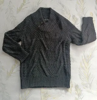 Jersey trenzado gris de Zara