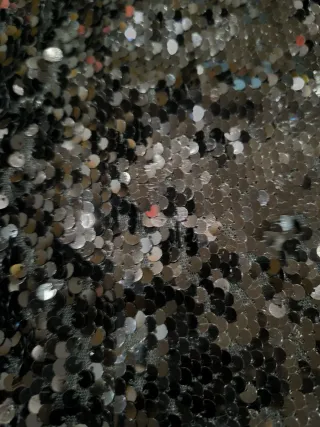 Top peplum negro lentejuelas