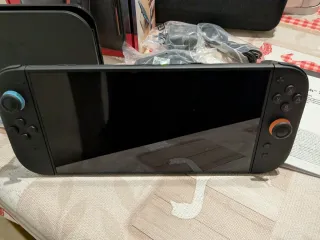 Nintendo Switch 2 Nero e Arancione + custodia