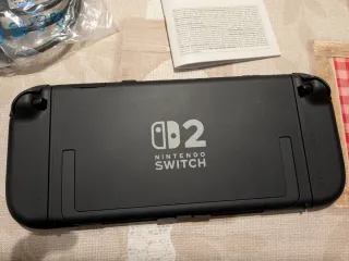 Nintendo Switch 2 Nero e Arancione + custodia