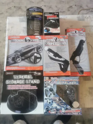 Lote Accesorios PS3: Volante, Pistola, Carga