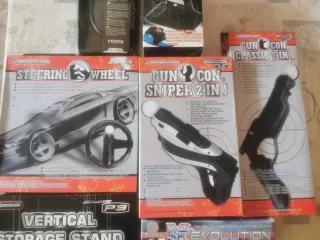 Lote Accesorios PS3: Volante, Pistola, Carga