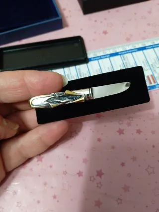 Fermacravatta vintage oro e argento