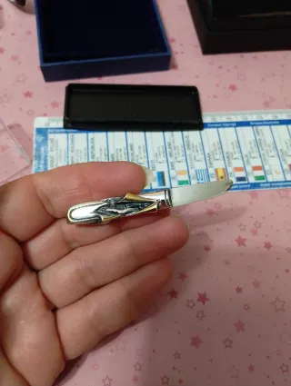 Fermacravatta vintage oro e argento