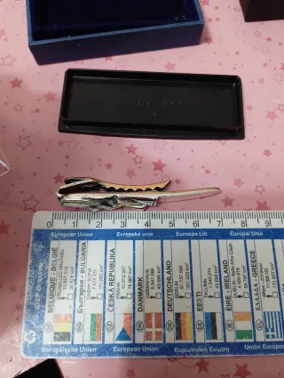 Fermacravatta vintage oro e argento