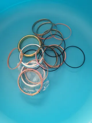 Lote de pulseras doradas y rosas