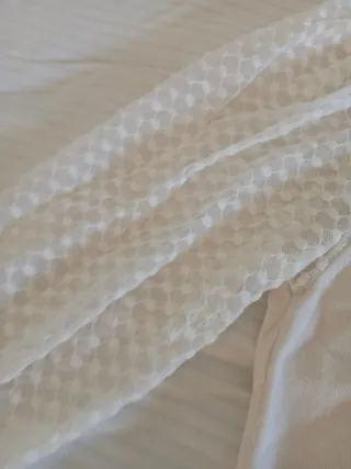 Jersey cuello alto mangas transparentes