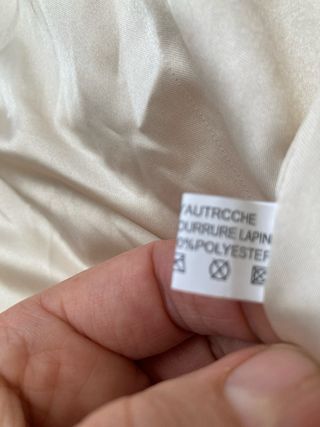 Chaleco de plumas beige y marrón