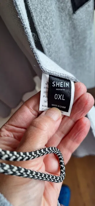 Parka asimétrica gris y PU negro T única